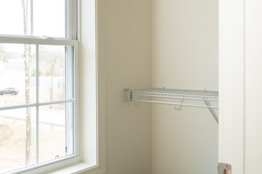 Bedroom 1 Walk-In Closet of a 3 Bedroom Unit in the Hidden Oak Community, a high-end townhouse community by Socha Companies in Manchester NH